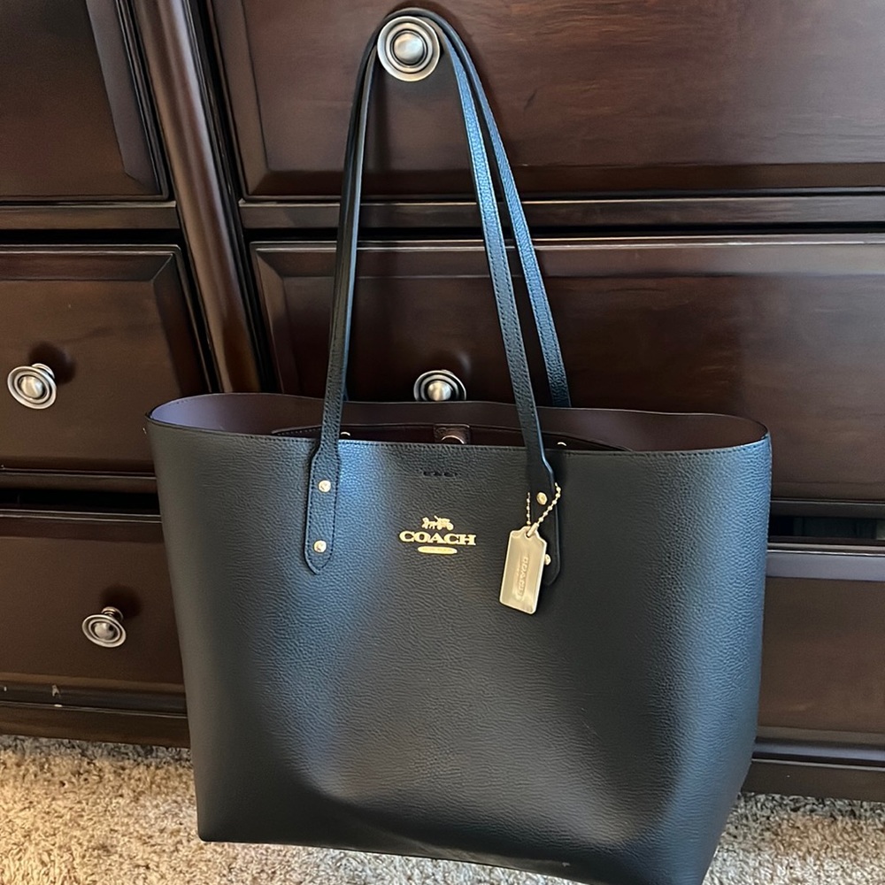 Black Coach tote with gold accents